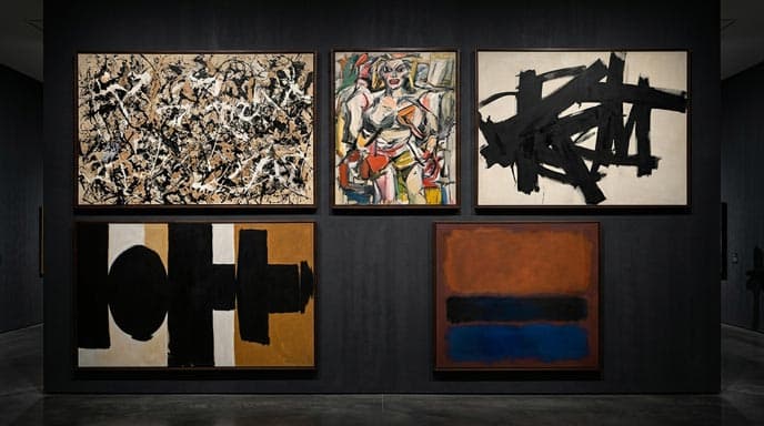 A wide-angle view of a modern gallery wall painted in dark charcoal gray, displaying five famous Abstract Expressionist paintings framed in dark wood and arranged in an aligned grid layout.